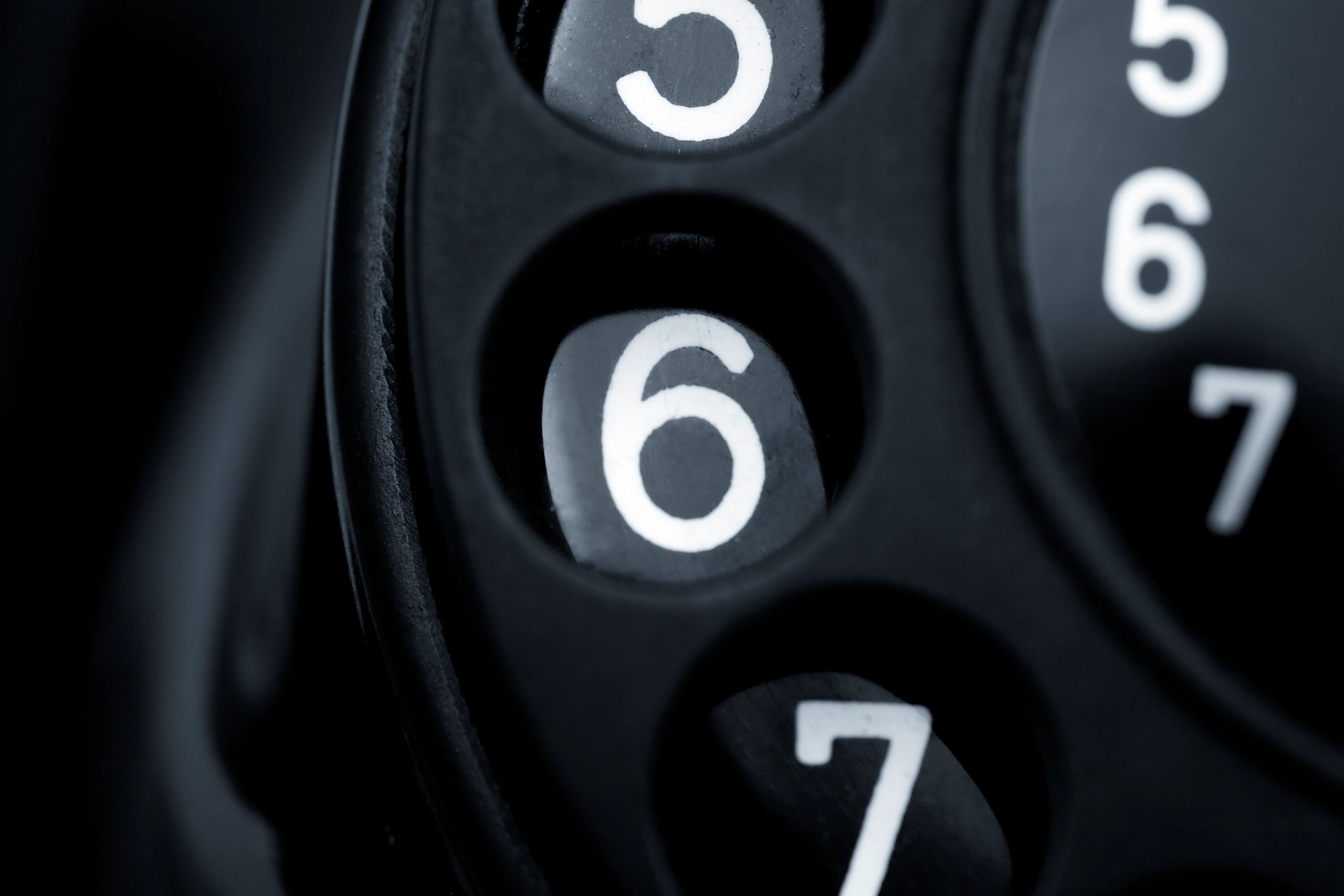Close-up of a vintage telephone dial plate