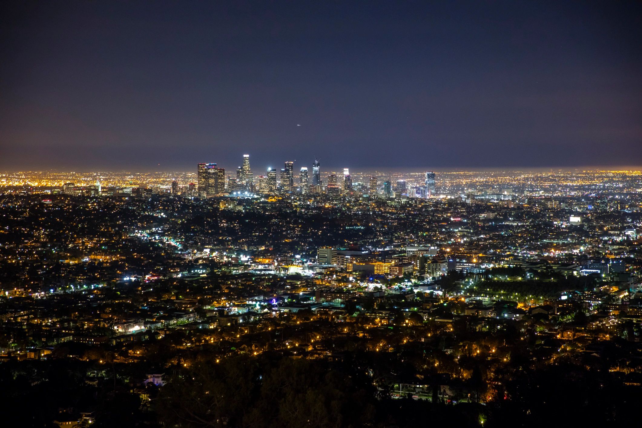 Aerial view of illuminated cityscape at night